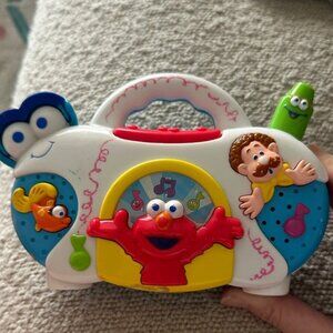 Vintage Sesame Street Musical Radio Toy with Elmo in Red, Blue, and Yellow